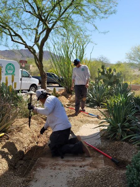 manning sprinklers employees installing a new sprinkler system in Phoenix, AZ